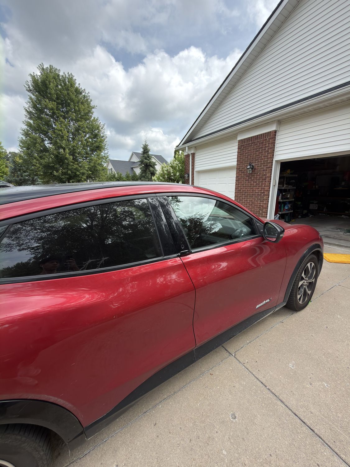 Red Ford Mustang Mach-E before hand wash, dull paint
